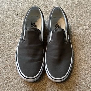 Grey slip on vans. Men/ 9.5 women/ 11